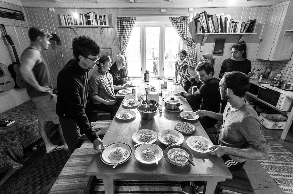 Enjoying a shared meal at the Stamsund hostel. Every day I stayed there, people went fishing, and the dinner afterwards was always delicious.